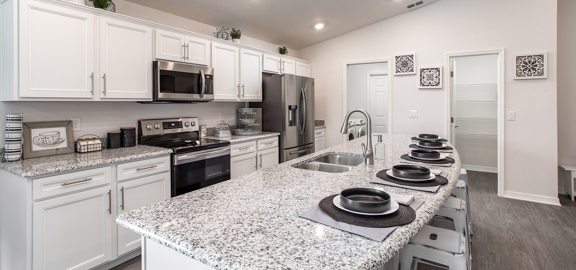 Kitchen with granite countertops in the Raychel by Highland Homes